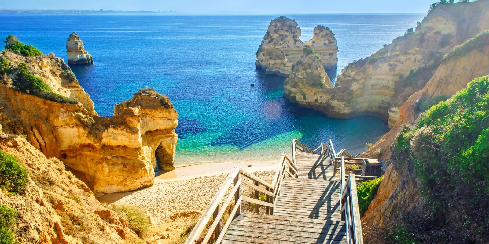 Wooden Wootbridge to beautiful beach, Praia Do Camilo, Portugal