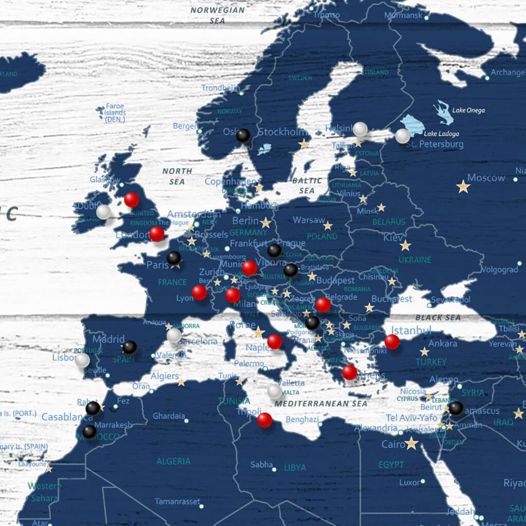 Closeup of Europe on Dark Blue Anniversary World Map with Pins