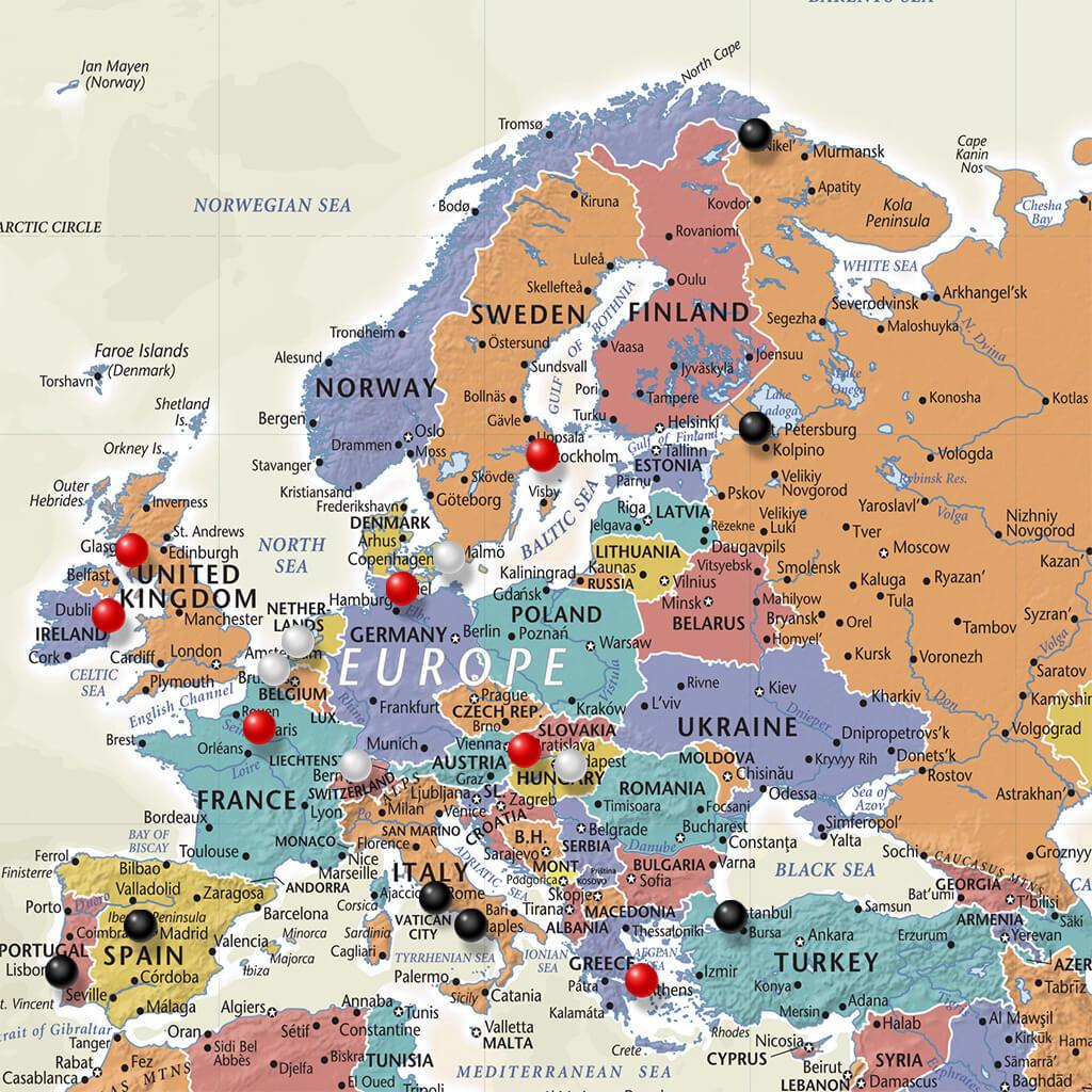 Closeup of Europe on Tan Oceans World Travelers Map with Pins